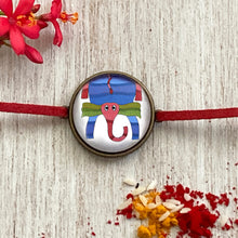 Load image into Gallery viewer, Rakhi Gift Hampers - Gond Art - Rakhi with Jigsaw Puzzle and Dominoes